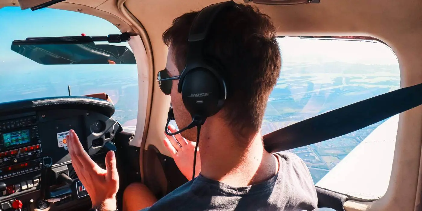 Andrew Serrazina CFI in the cockpit of a Piper PA-28 during a flight review